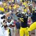 Michigan defensive tackle Quinton Washington and linebacker Cameron Gordon attempt to block a throw by UMass quarterback Mike Wegzyn in the fourth quarter at Michigan Stadium on Saturday. Melanie Maxwell I AnnArbor.com